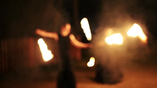  blurred background fire show, fakirs perform.