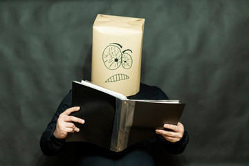 Emotion concept. A man is reading a book. Facial expression focused and attentive.