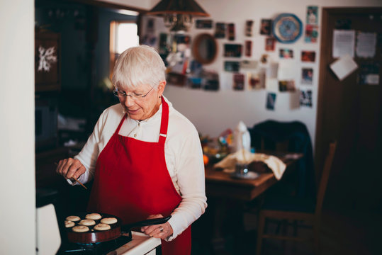 Senior woman cooking traditional Swedish Christmas dumplings