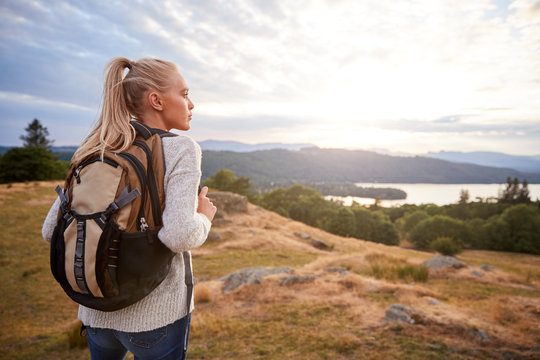 A Young Adult Caucasian Woman Standing Alone On The Hill During Hiking, Admiring View, Back View