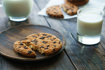 sweet homemade biscuits, handcrafted pastry, family recipe. chocolate chip cookies and glass of milk