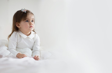 Naklejka premium Pretty baby girl in white dress