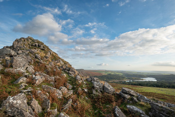 Stunning Autumn sunset landscape image of view from Leather Tor towards Burrator Reservoir in Dartmoor National Park