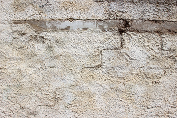 Naklejka na ściany i meble Old white grey gray plaster stucco wall outer weathered stained detail close up