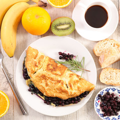 blueberry omelet with fruit and coffee