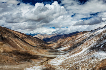 Fototapeta premium View over valley and Karakorum range from Khardung La pass, Ladak