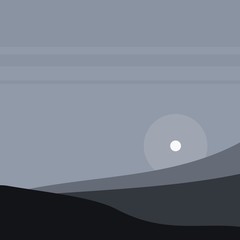 sunset in the fog over the hills