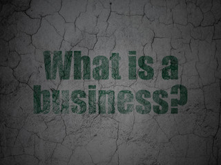 Business concept: Green What is a Business? on grunge textured concrete wall background