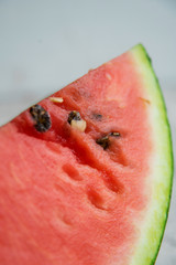 Slices of fresh ripe watermelon on a light background