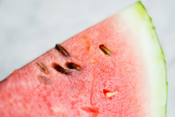 Slices of fresh ripe watermelon on a light background