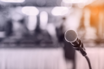 Blurred and Soft focus of head microphone on stage of Education meeting or event whit blurred background,Education meeting and event on stage concept and copy space - obrazy, fototapety, plakaty