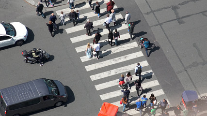 Paris, France - circa May, 2017: Aerial view of pedestrian crossing on street in Paris next to Eiffel Tower - obrazy, fototapety, plakaty