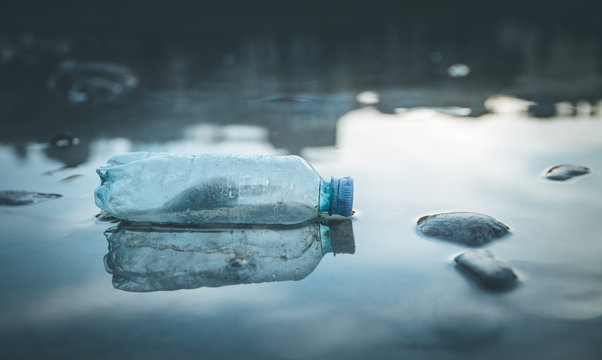 Environmental pollution: plastic bottle on the beach