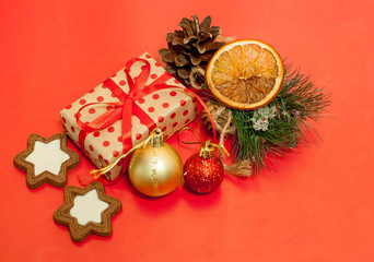 Christmas gifts on a red background with a red ribbon, Christmas toys
