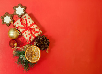 Christmas gifts on a red background with a red ribbon, Christmas toys