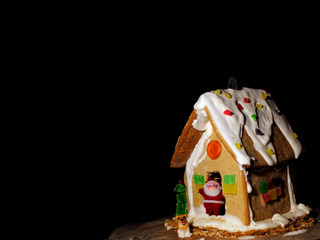 Beautiful gingerbread house on a dark background