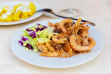 Spanish tapas, fried shrimps and fried potato chips and aioli