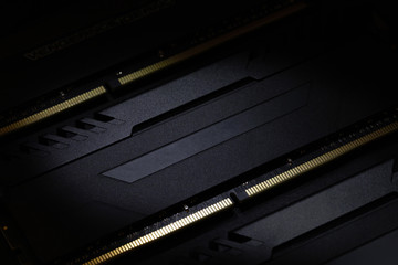 Close-up of Computer RAM (Random Access Memory) module on black background.