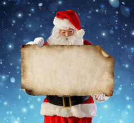 Santa Claus Reading Wish List In Snowy Night
