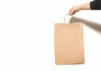 Craft package in hand on white background