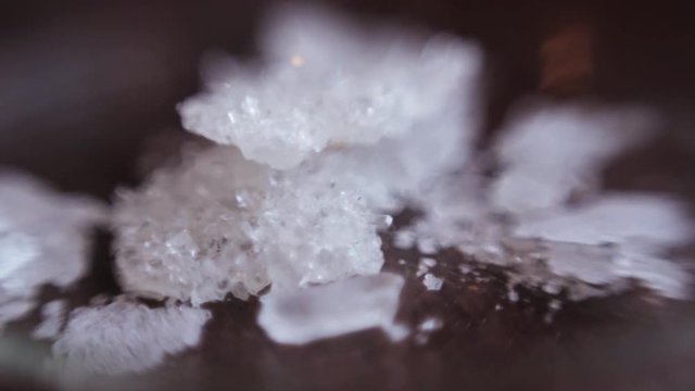Nice samples of white precious metals in research laboratory of high school. Paricles of minerals. Chemistry. Indoors. Close-up.