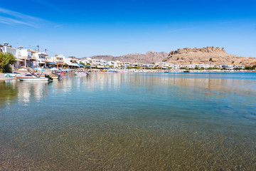 Fototapeta na wymiar Panoramatic view of Haraki beach with apartment houses (Rhodes, Greece)
