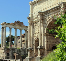 Arch of Emperor Septimius Severus and Temple of Saturn at the Roman Forum in Rome, Italy