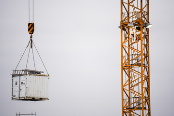 floating house elements on a crane