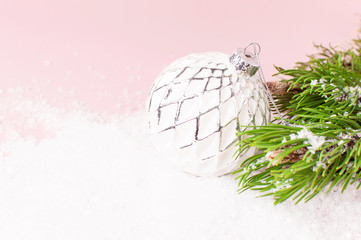 Vintage Christmas New Year balls in the snow and pine branches on pink background Flat Lay copy space. Holiday Baubles, beautiful Decoration Festive decor, celebration Xmas holiday greeting card