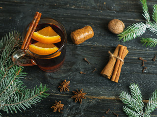 Mulled wine in a glass mug . Winter composition with hot drink