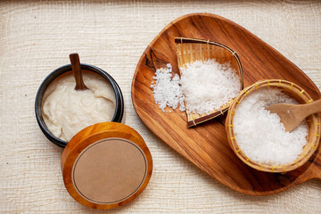 Fototapeta na wymiar Spa Set. Handmade Salt Scrub And Cream Scrub With Coconut Oil. Thailand.