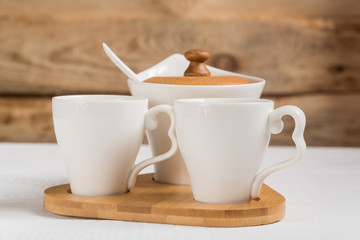 coffee. two cups of coffee on a wooden table