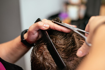 Man having his hair cut in a barbershop
