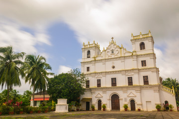 Fototapeta na wymiar Ancient St. Thomas church landscape in Aldona Goa surrounded by monsoon clouds 