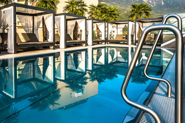 sun lounger at a swimming pool © fottoo