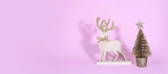 Christmas wooden tree with reindeer over light blue background.