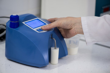 analysis and testing of dairy products on a modern device. test laboratory of a milk factory