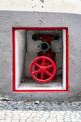 red fire hydrant on wall