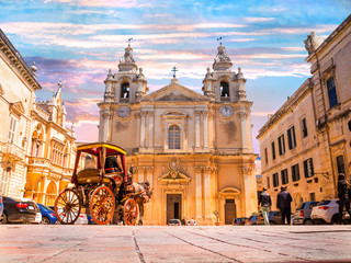 Metropolitan Roman Catholic Cathedral of Saint Paul in main town square of Mdina village in  Malta,...