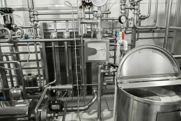 storage and pasteurization tank at the milk factory. equipment at the dairy plant - obrazy, fototapety, plakaty