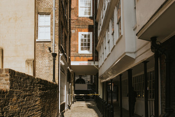 Middle Temple Lane, a narrow classic street, with access from Strand St, during a sunny day, in Westminster city, London, United Kingdom