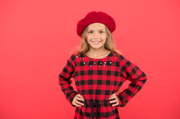 How to wear beret like fashion girl. Fashionable beret accessory for female. Kid little cute girl with long hair posing in hat red background. How to wear french beret. Beret style inspiration