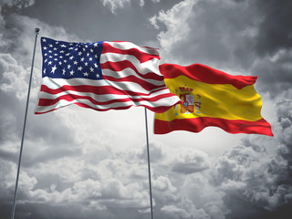 United States of America, USA & Spain Flags are waving in the sky with dark clouds