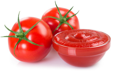 Fresh tomatoes with ketchup on white background
