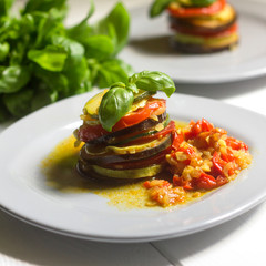 healthy vegetarian french ratatouille on white wooden background