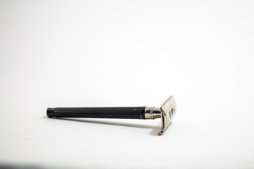 Used razor, white background, single blade