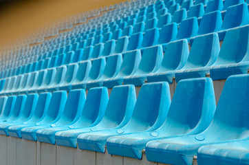 Empty blue stadium seats,
