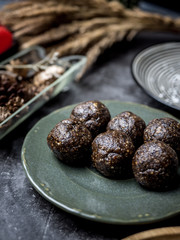 Healthy organic date energy balls with dark chocolate, dried fruits and nuts. Food for healthy lifestyle.