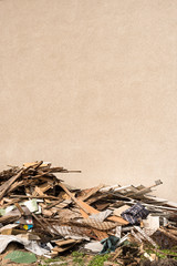Pile of construction waste and blank wall - building, timber, boards, wall - copy space