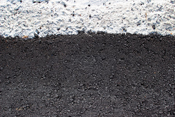 New asphalt surface texture detail with white gravel